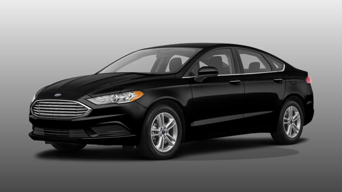 Sedan preto blindado em perfil lateral